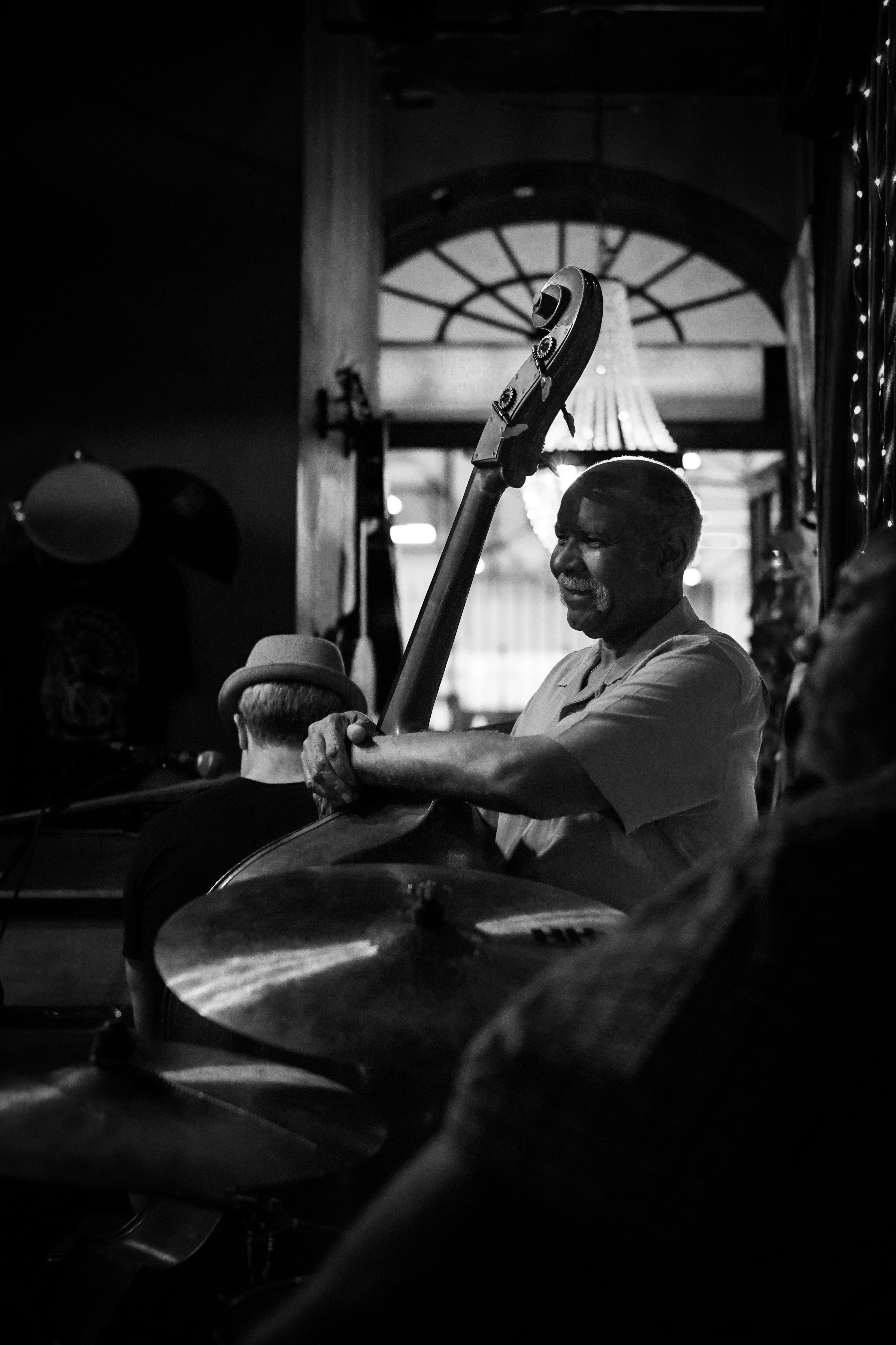 A man playing a musical instrument in a dark room