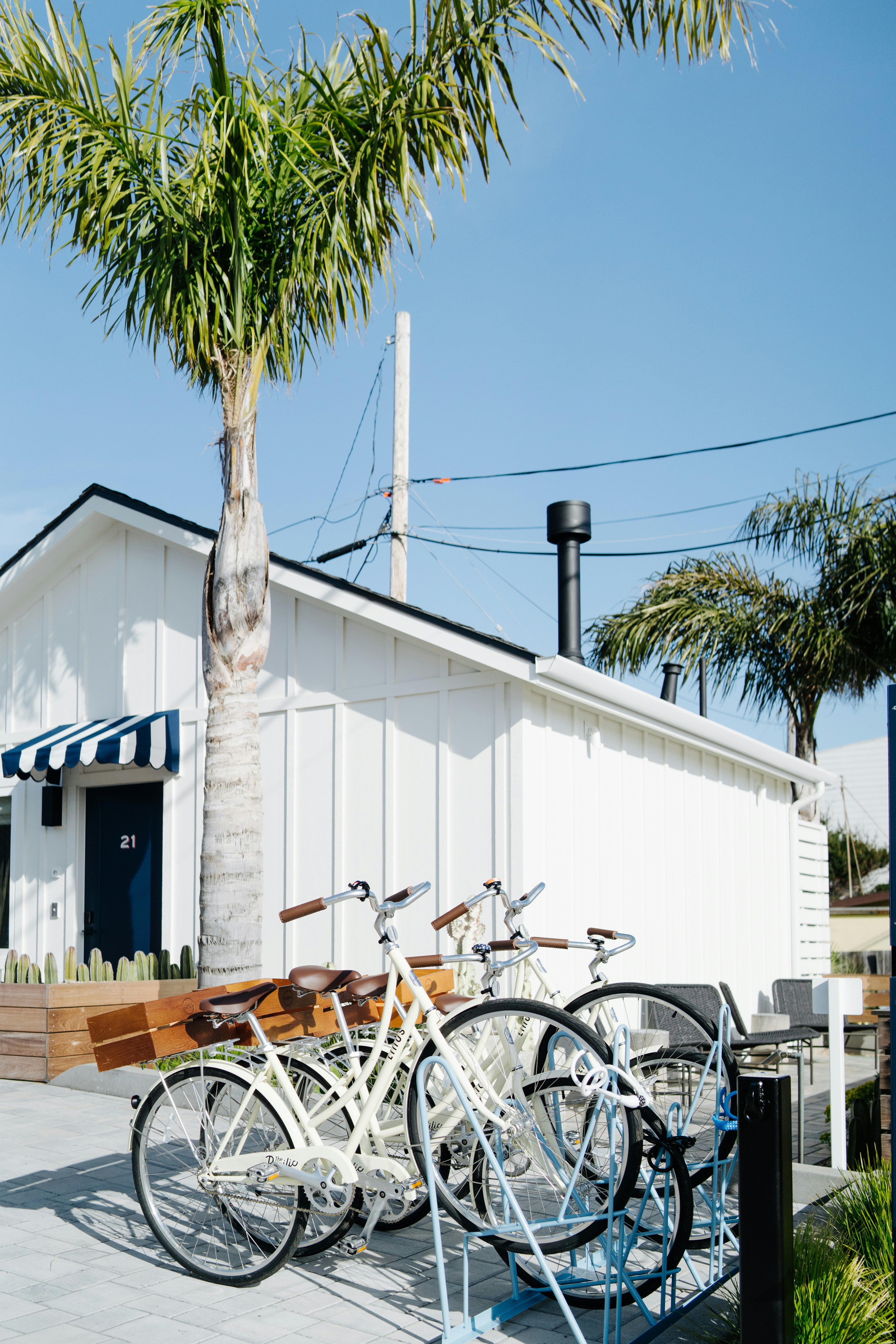 A couple of bikes are parked outside of a building