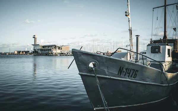 A boat that is sitting in the water — Curonian Spit, Lithuania