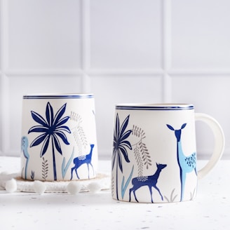 A couple of mugs sitting on top of a table