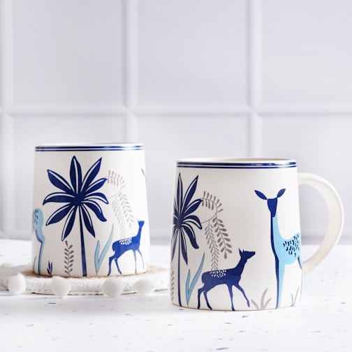 A couple of mugs sitting on top of a table