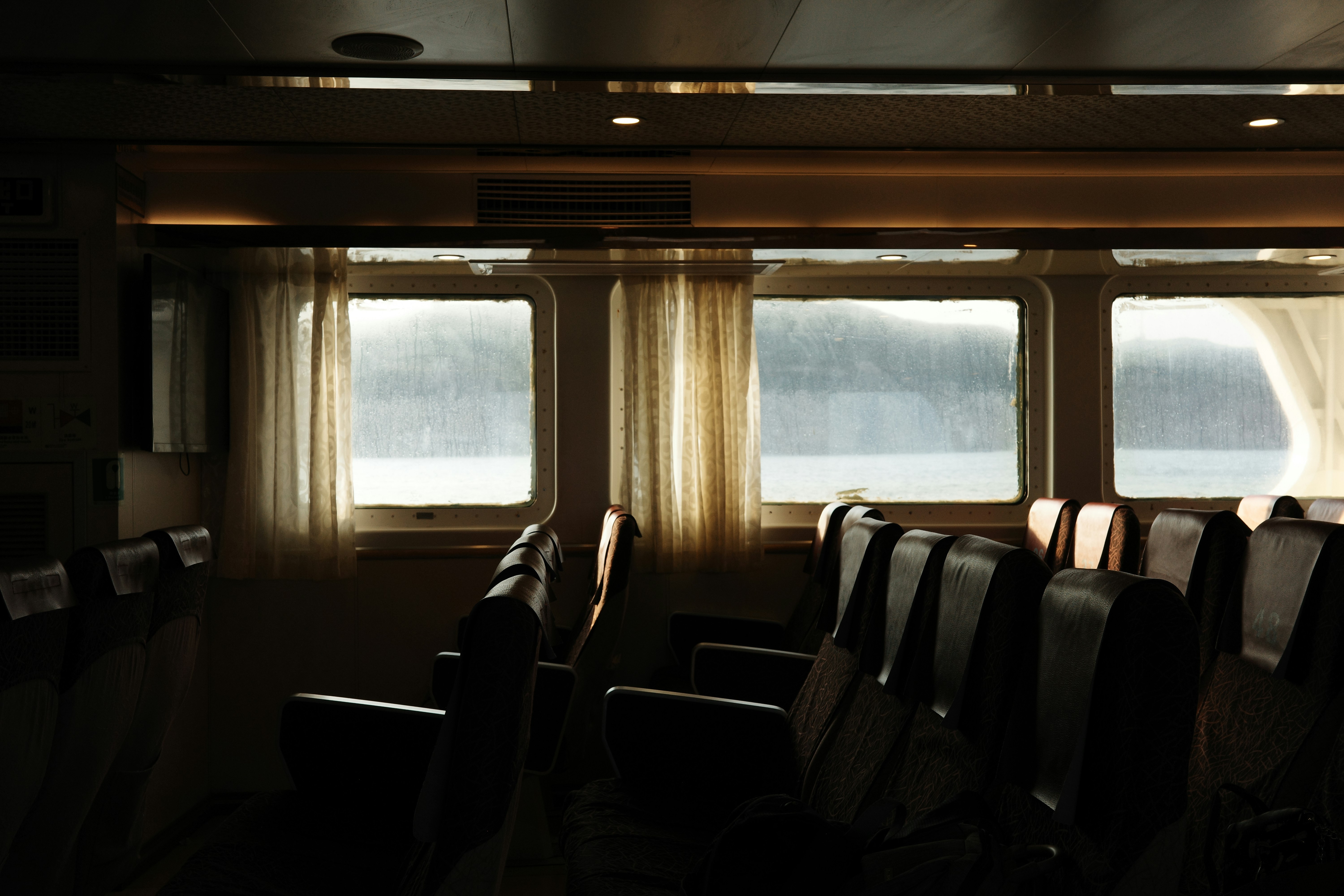 A row of chairs sitting in front of a window