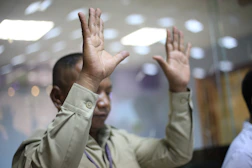 A man with his hands up in the air