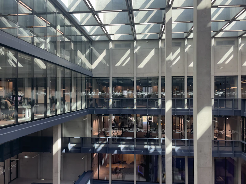 Glass-walled office atrium with skylight