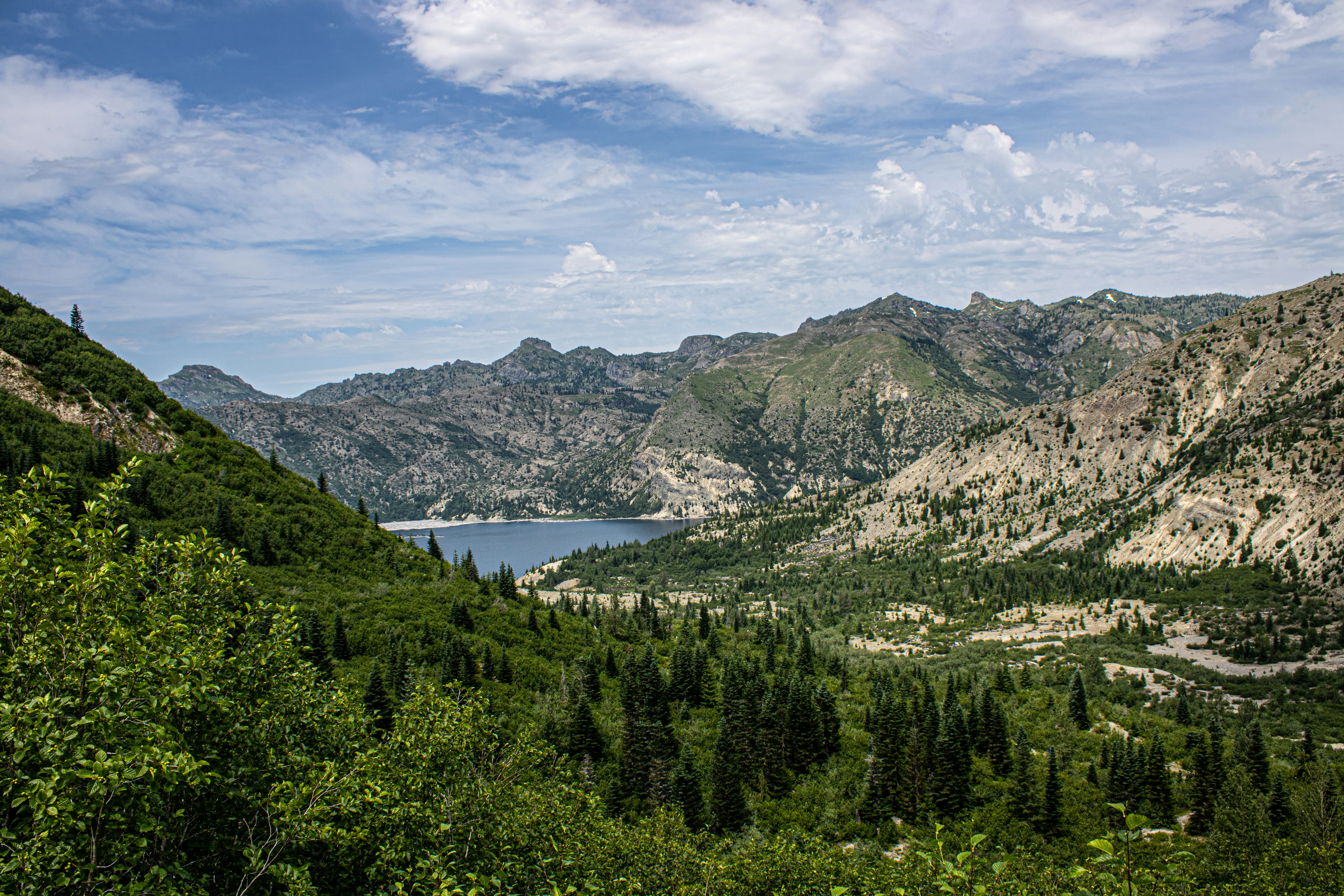 Stop image for Taos Adventure Loop: 3 Days of Family & Nature Escapes - A scenic view of a lake surrounded by mountains -  in Southwest USA - Photo by Peter Robbins on Unsplash