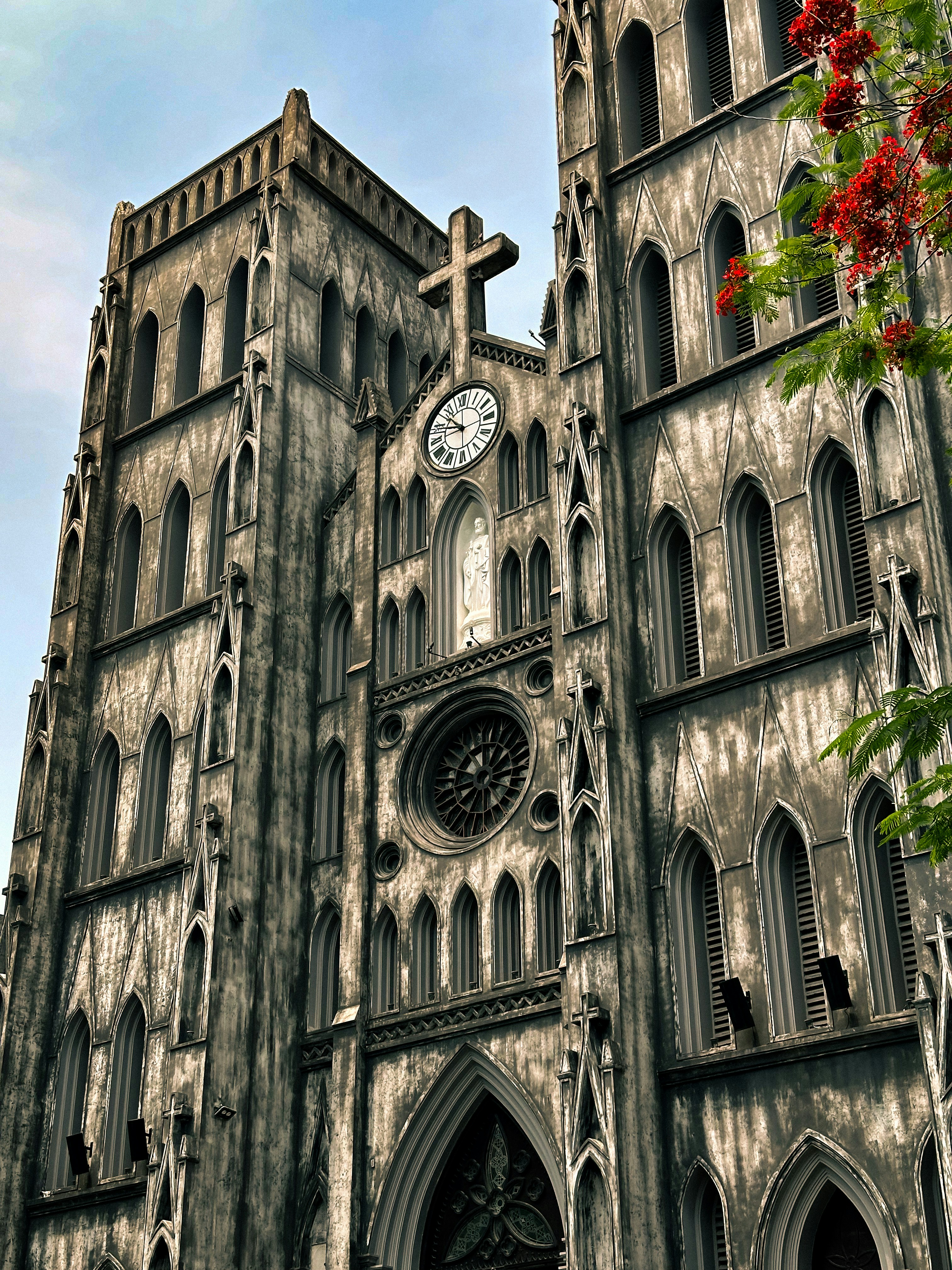 A large cathedral with a clock on the front of it