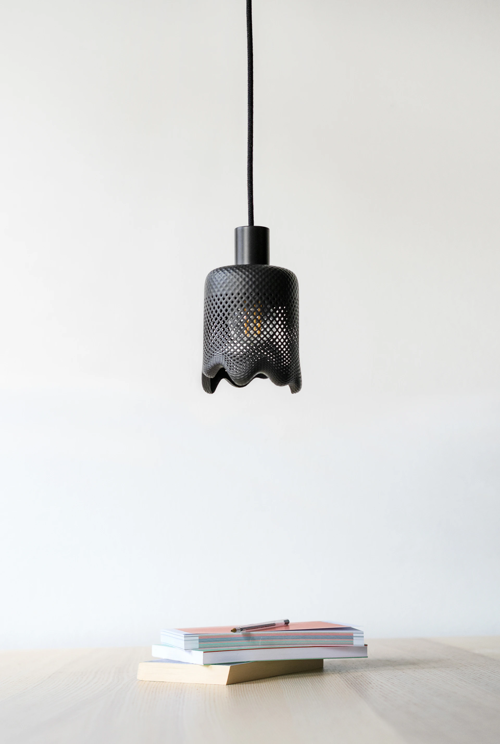 A table with a book and a lamp on it