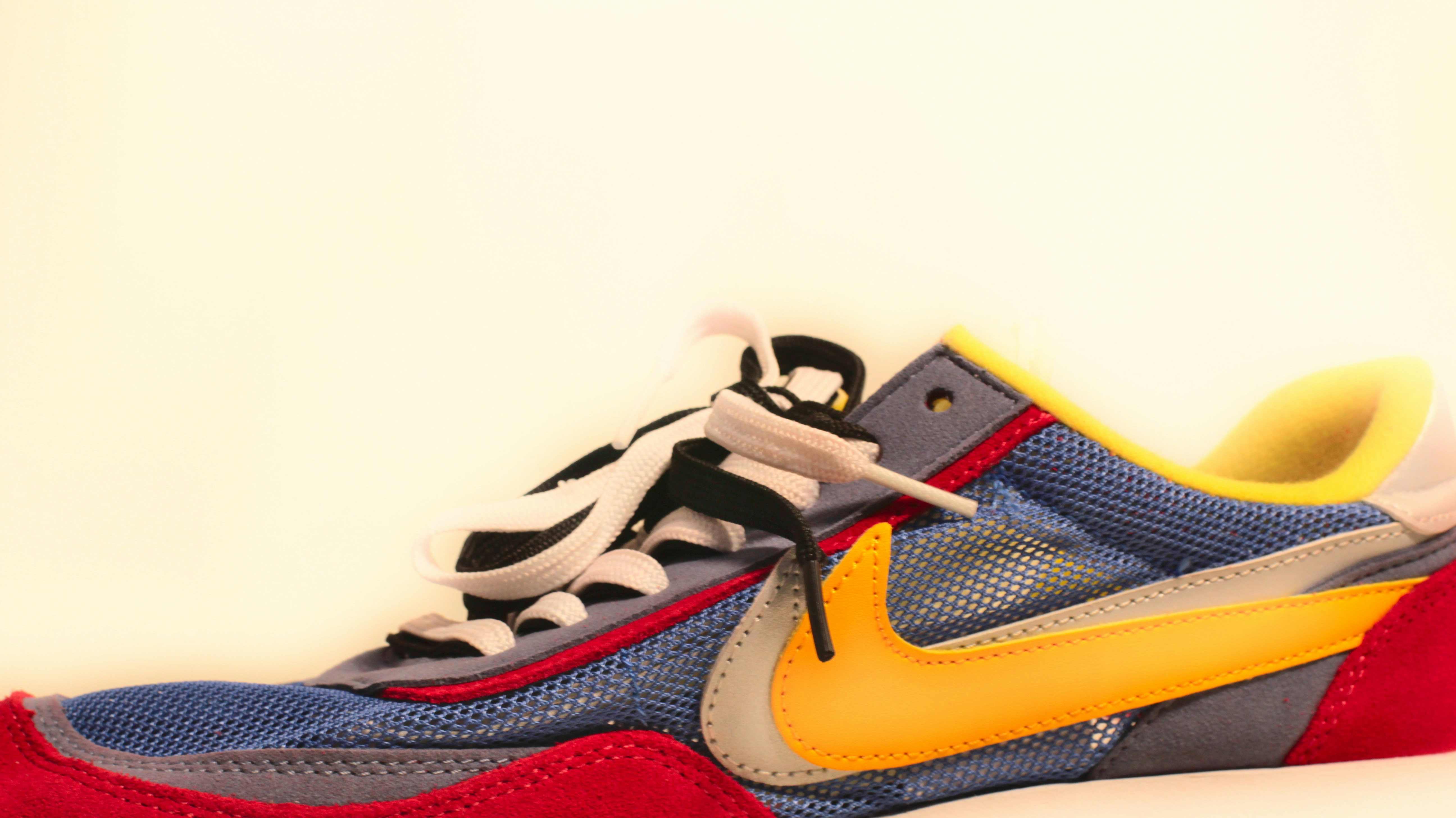 A pair of colorful sneakers on a white surface