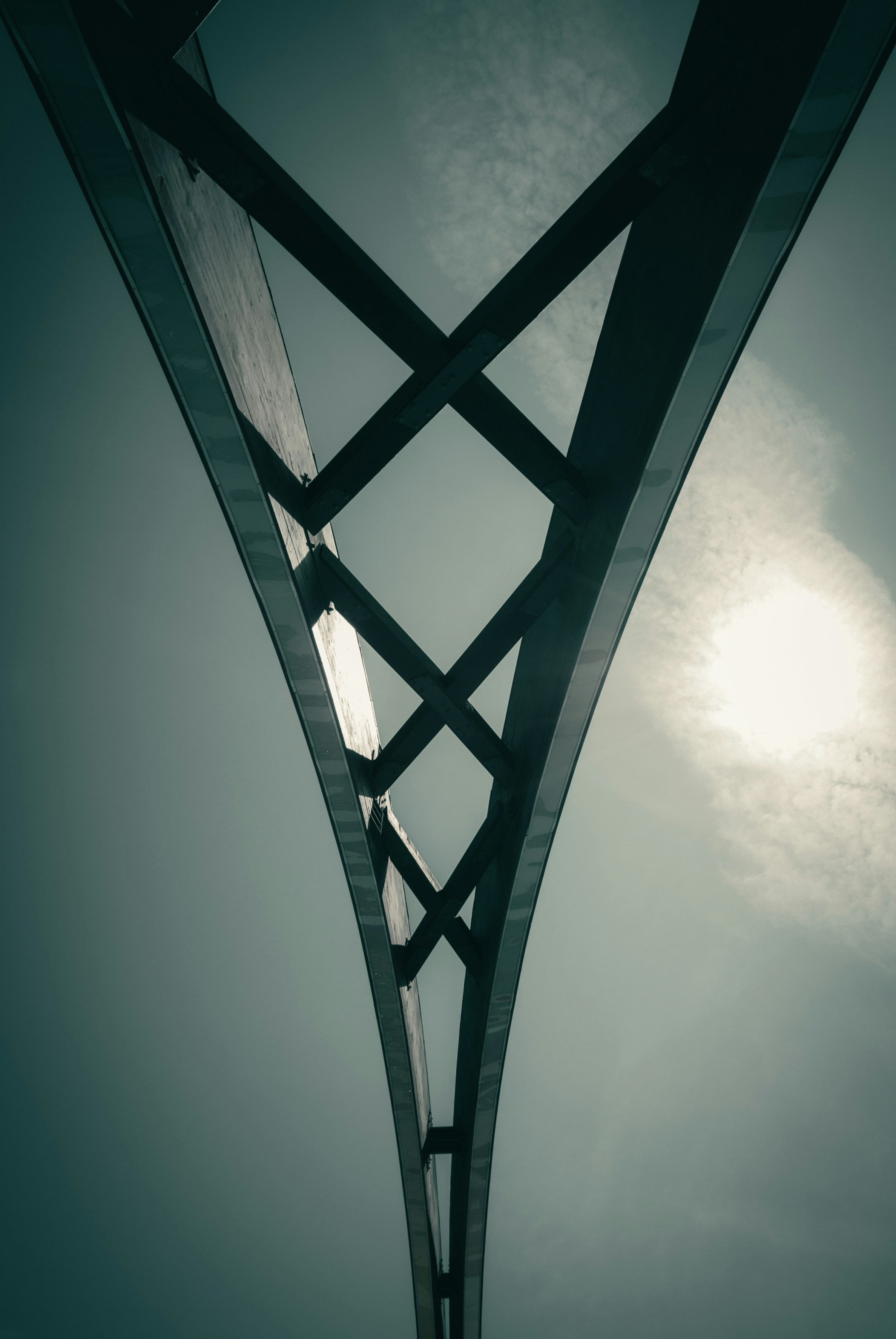 A tall metal structure with a sky background