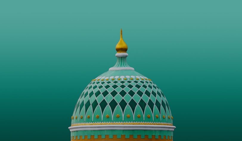 A green dome with a yellow top on a green background