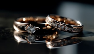 A couple of wedding rings sitting on top of a table