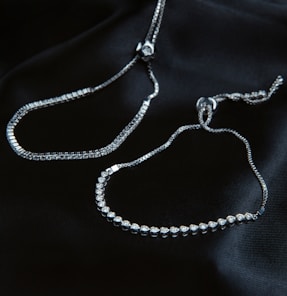 A close up of a necklace on a black cloth