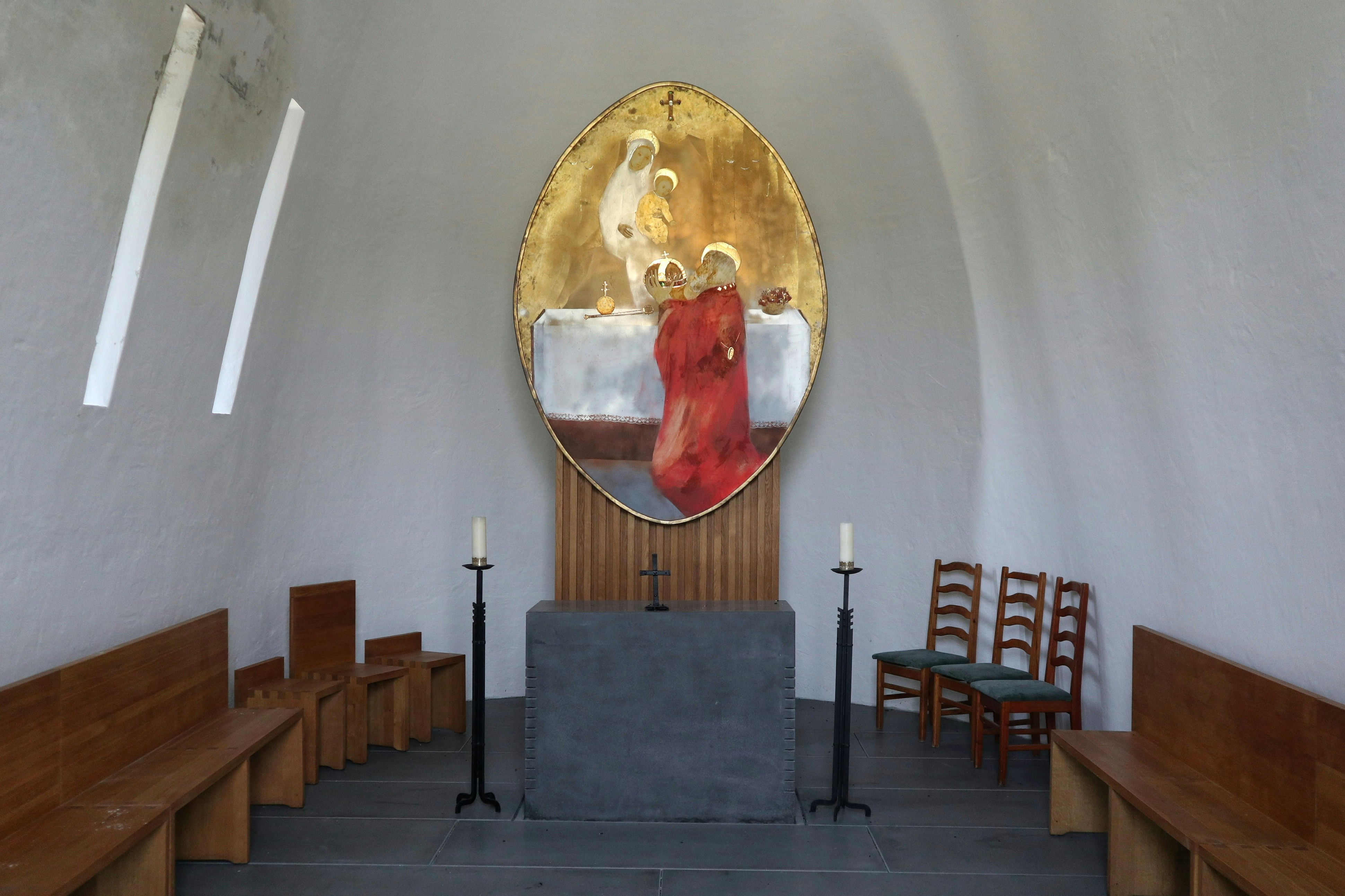A church with pews and a round mirror