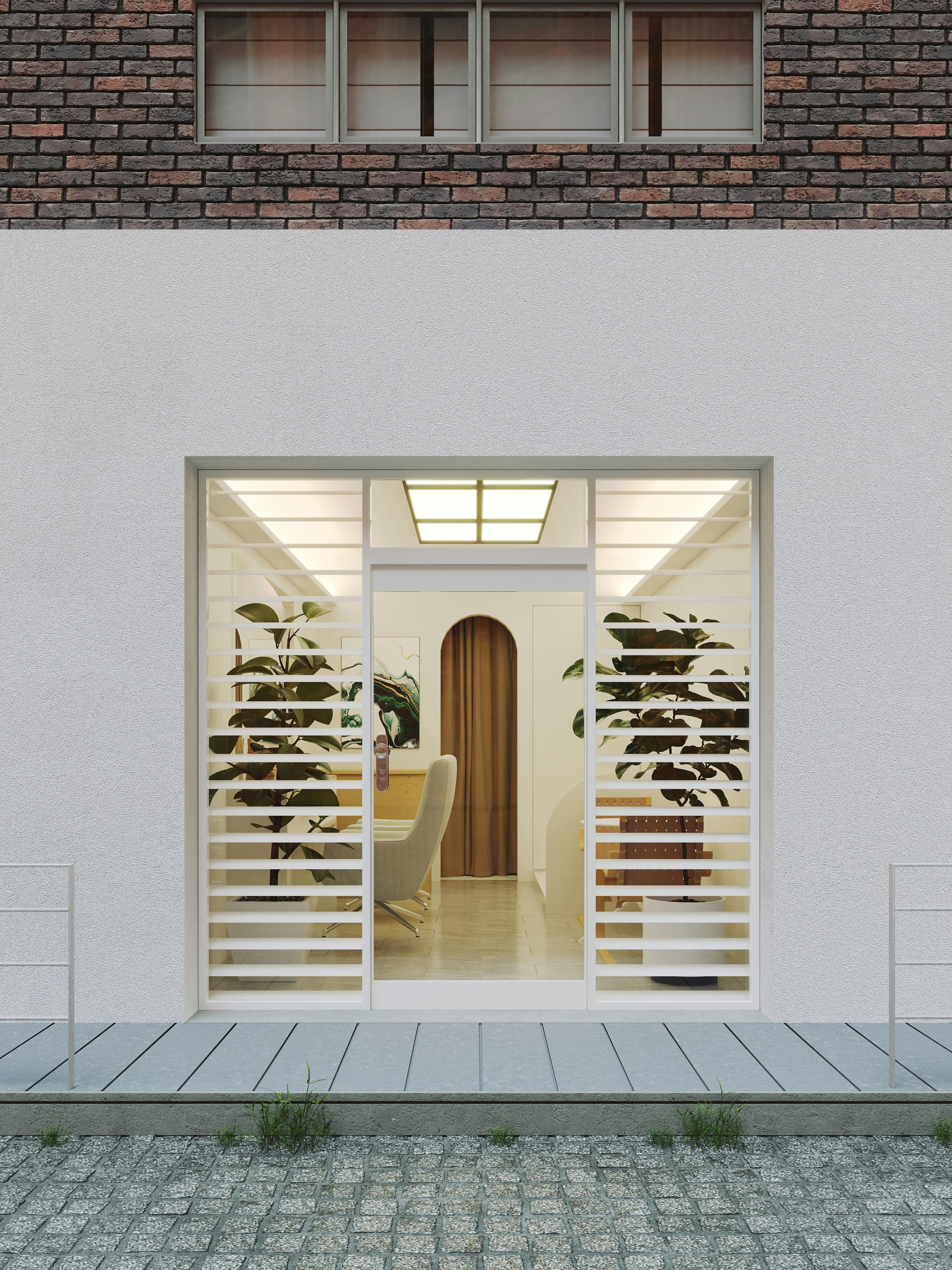 A brick building with a white door and windows