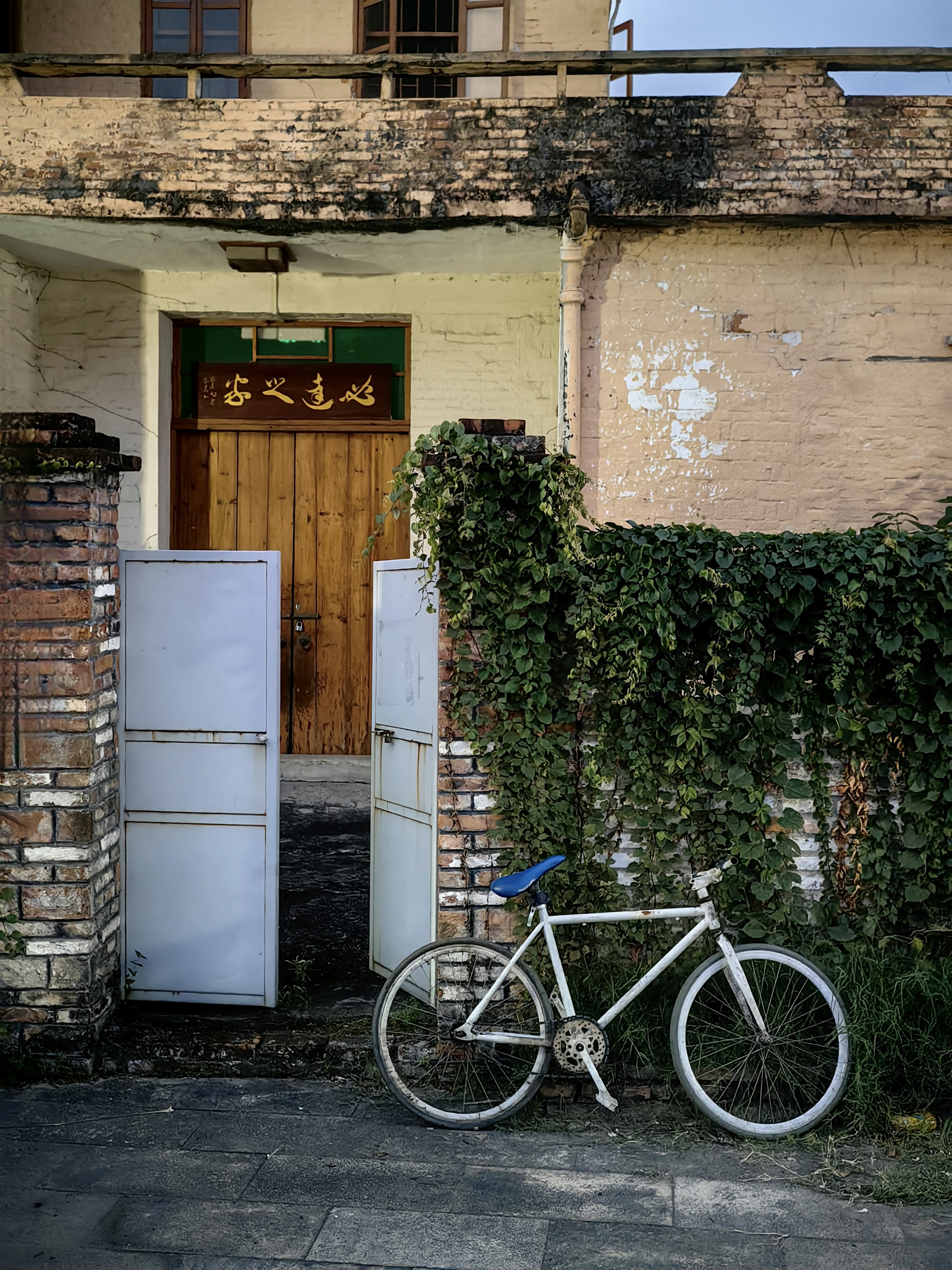 A bicycle parked in front of a brick building