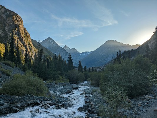 A river running through a lush green forest — Karakol, Kyrgyzstan