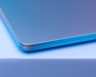 A close up of a laptop computer with a blurry background