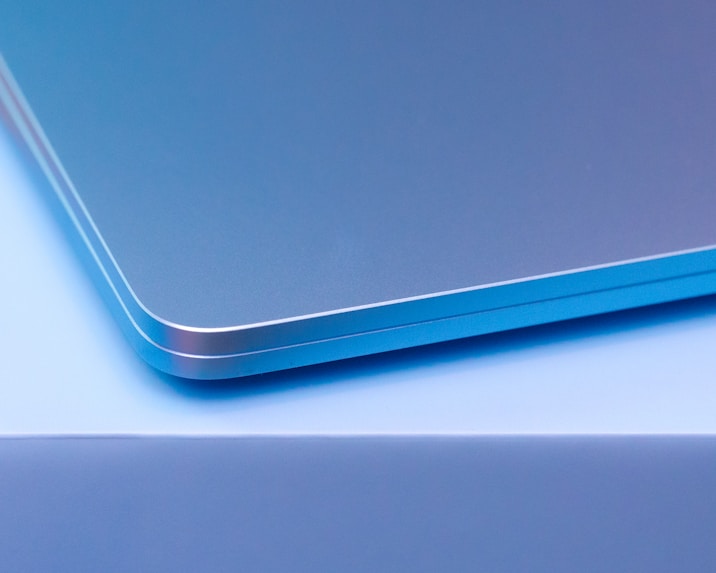 A close up of a laptop computer with a blurry background