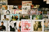 A bunch of magazines are stacked on a wall