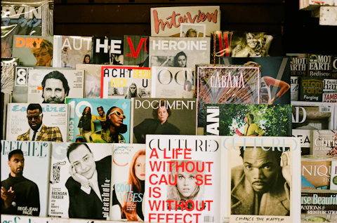 Rows of magazines displayed on a wall at a bookstore, spines and covers facing out