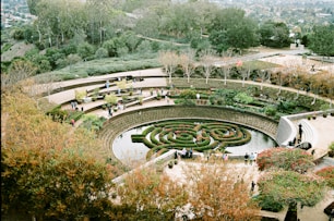 An aerial view of a circular garden in a park