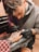 A man getting a tattoo on his arm