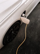 An electric car plugged in to a charger