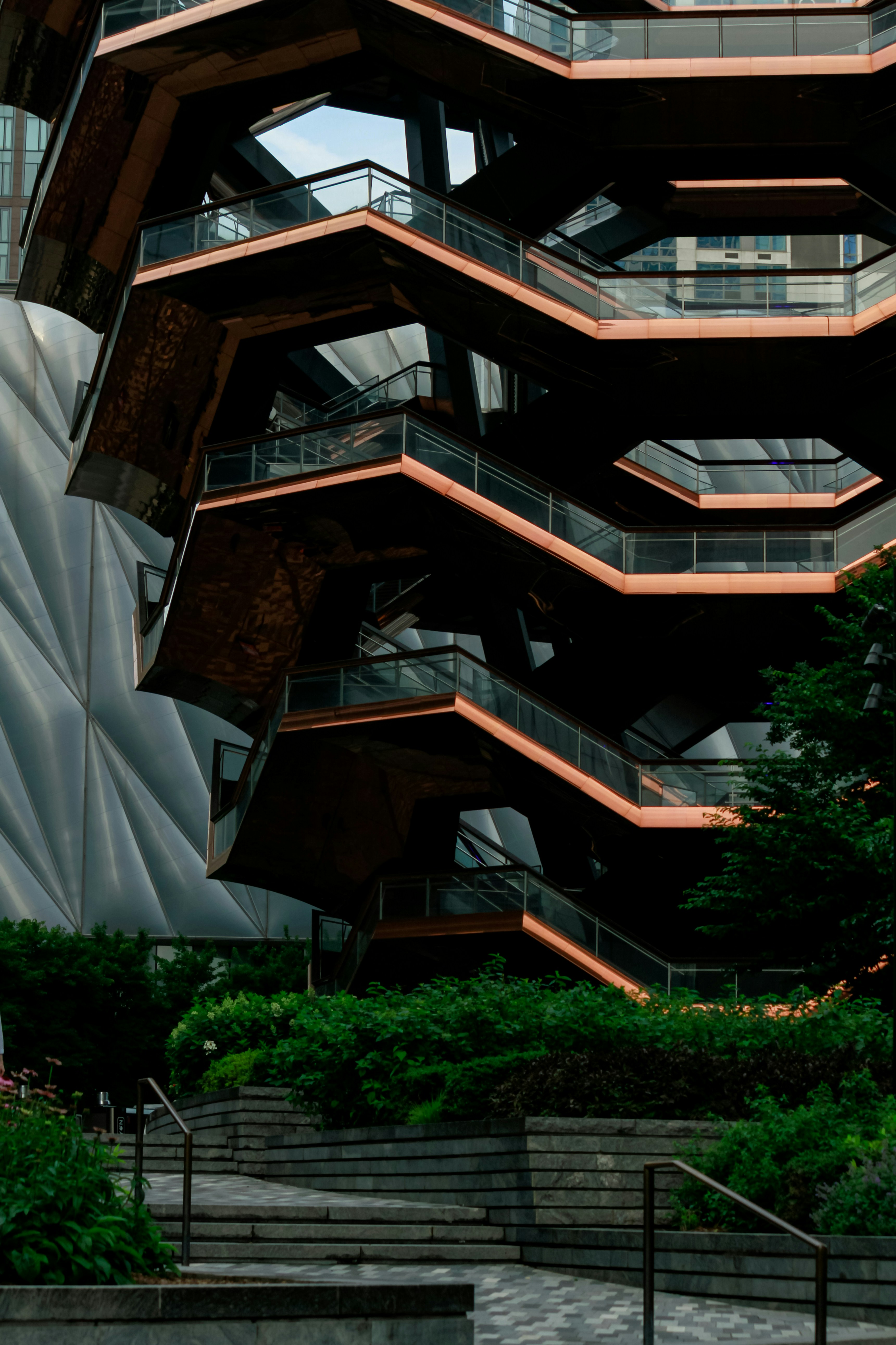 A tall building with a bunch of balconies on top of it