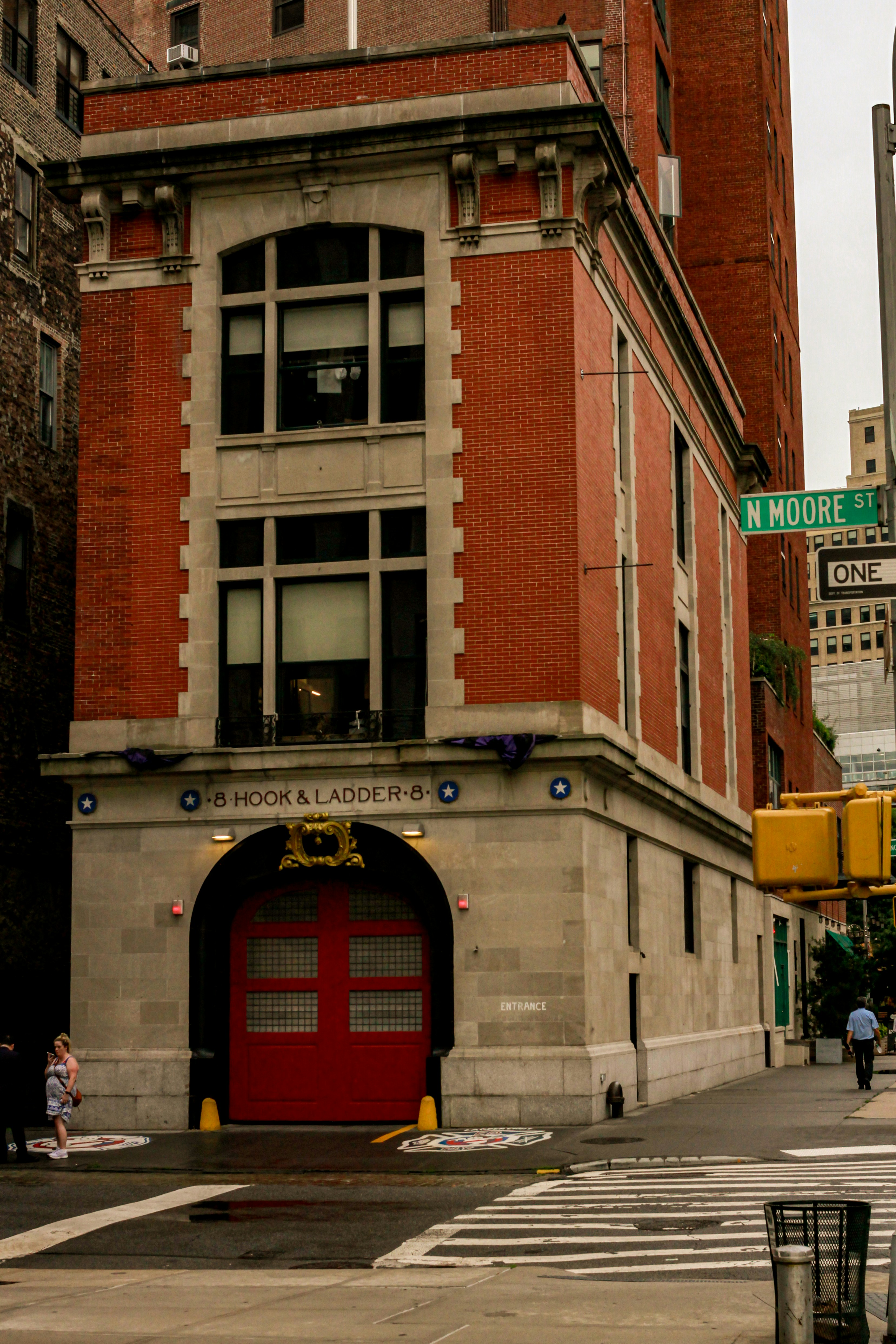 A red fire hydrant sitting on the side of a road