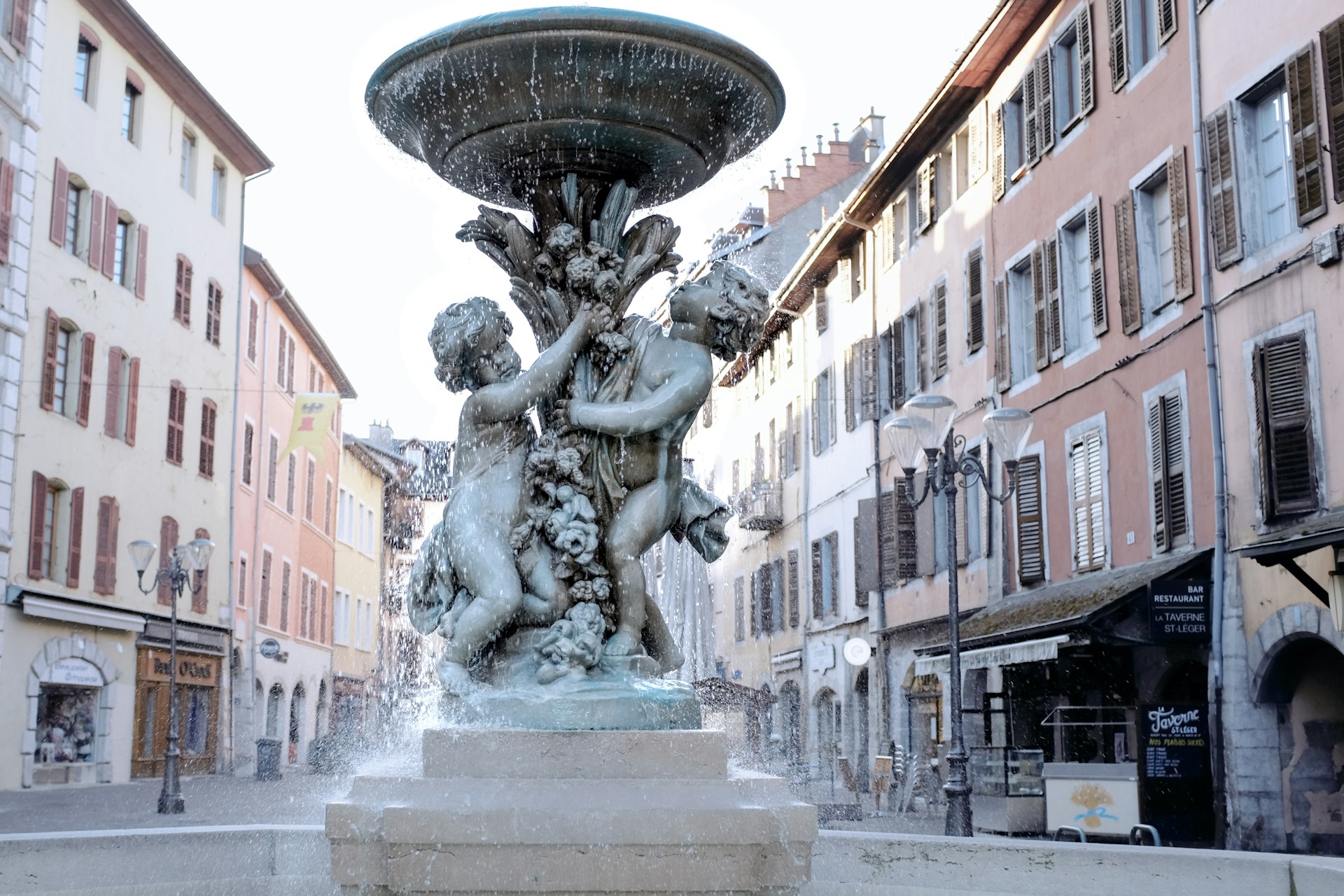 A fountain in the middle of a city square