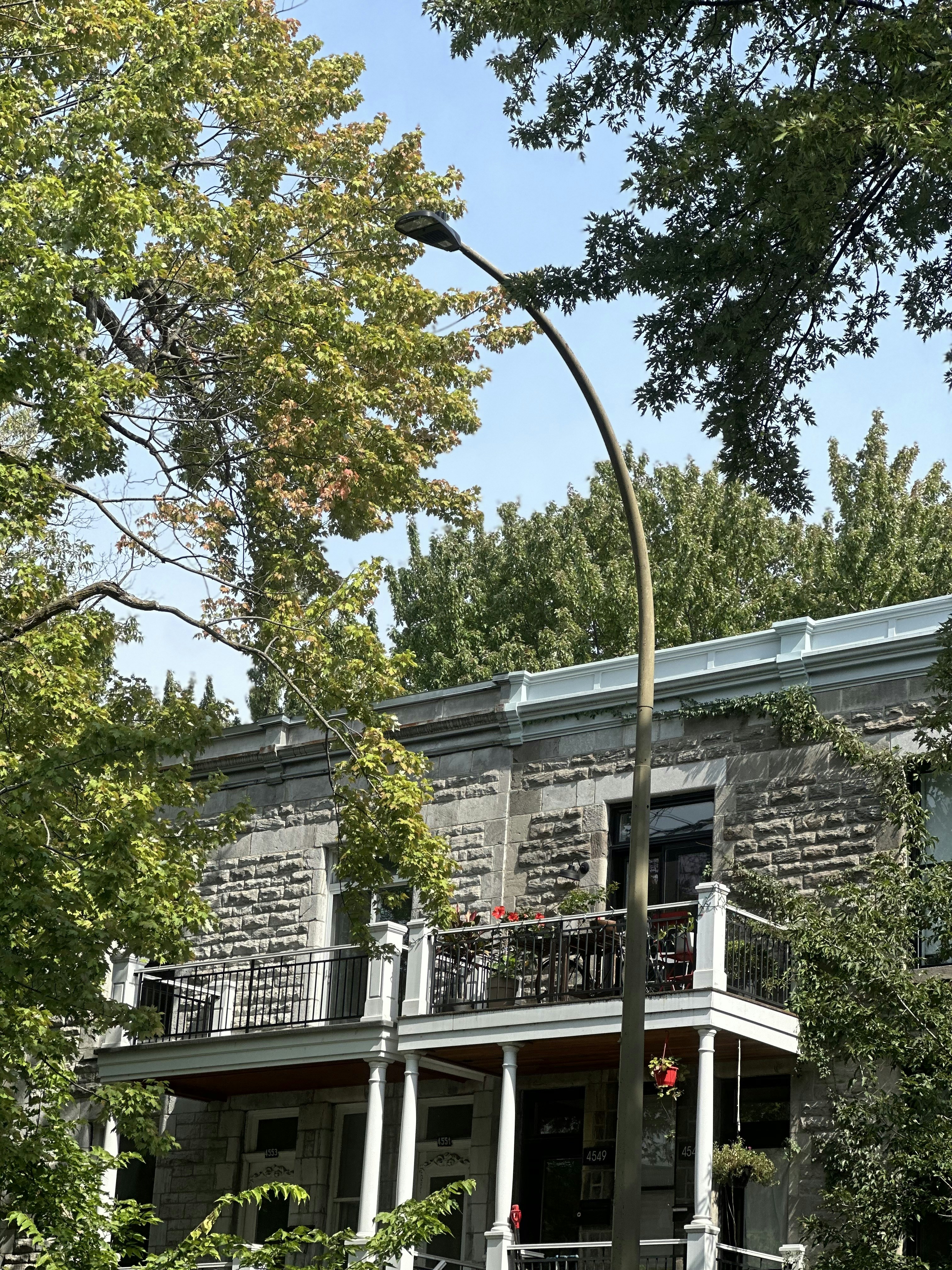 A large brick building with a clock on the front of it
