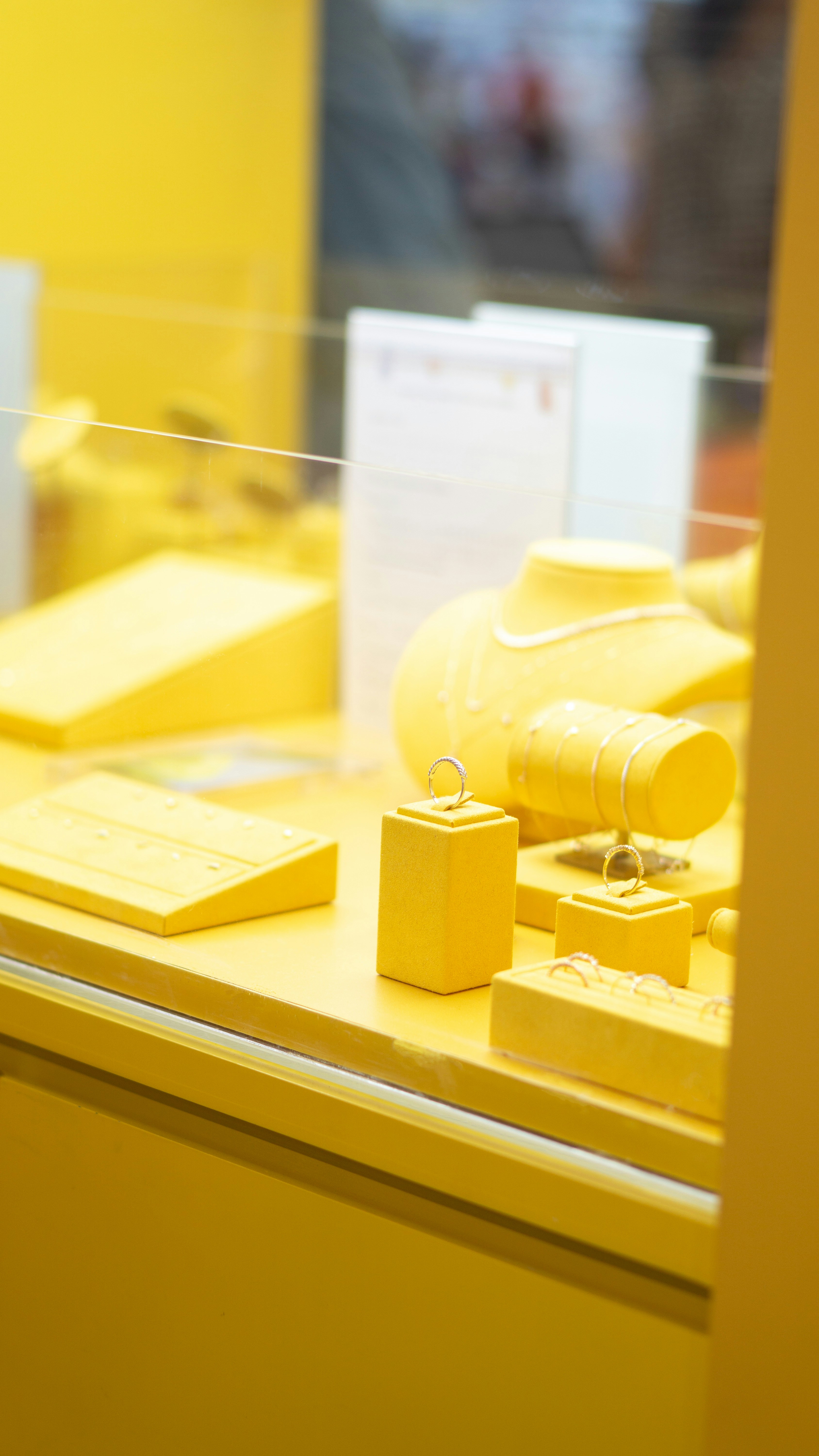 A display case with yellow items on it