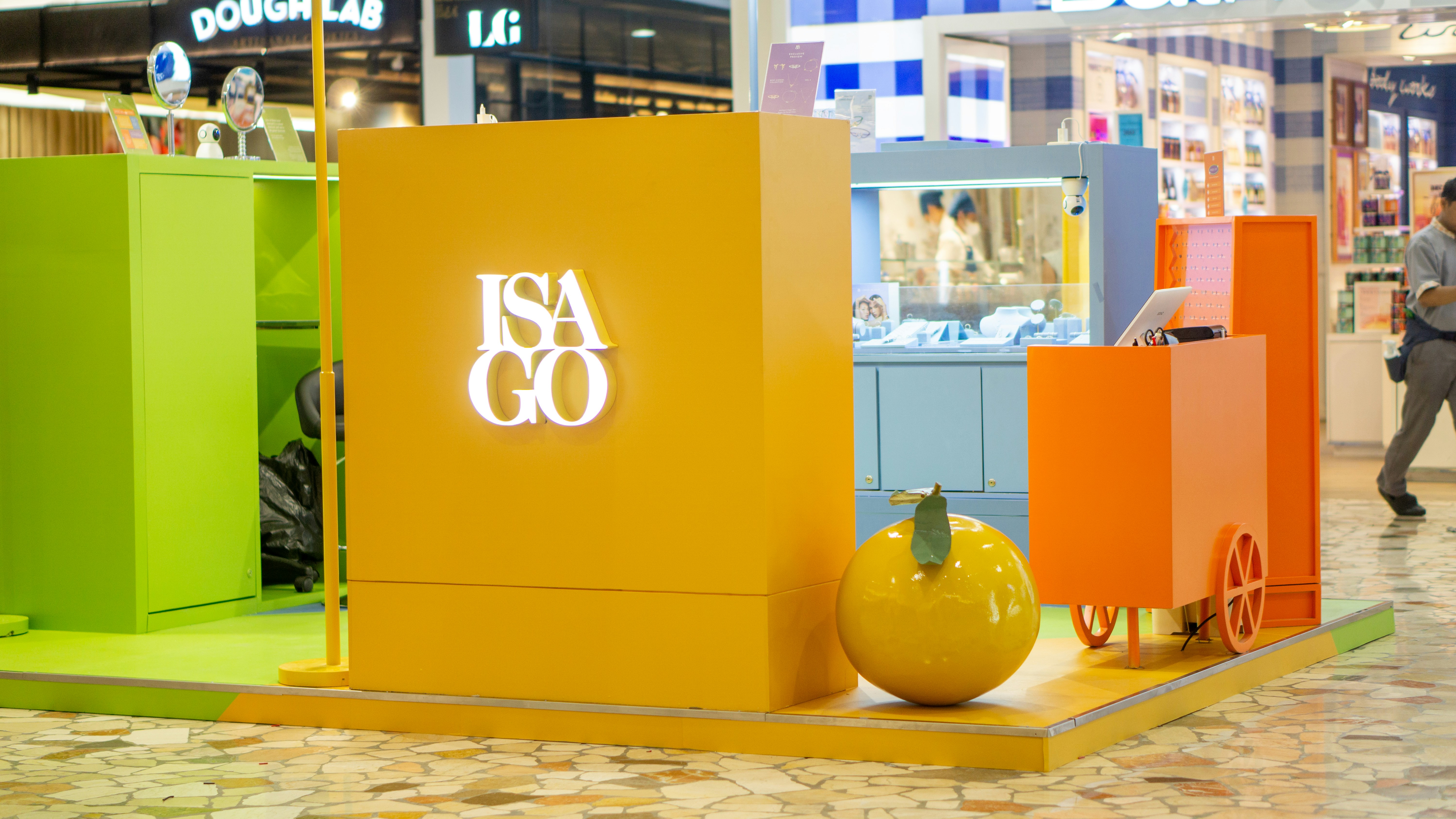 A group of people walking around a store