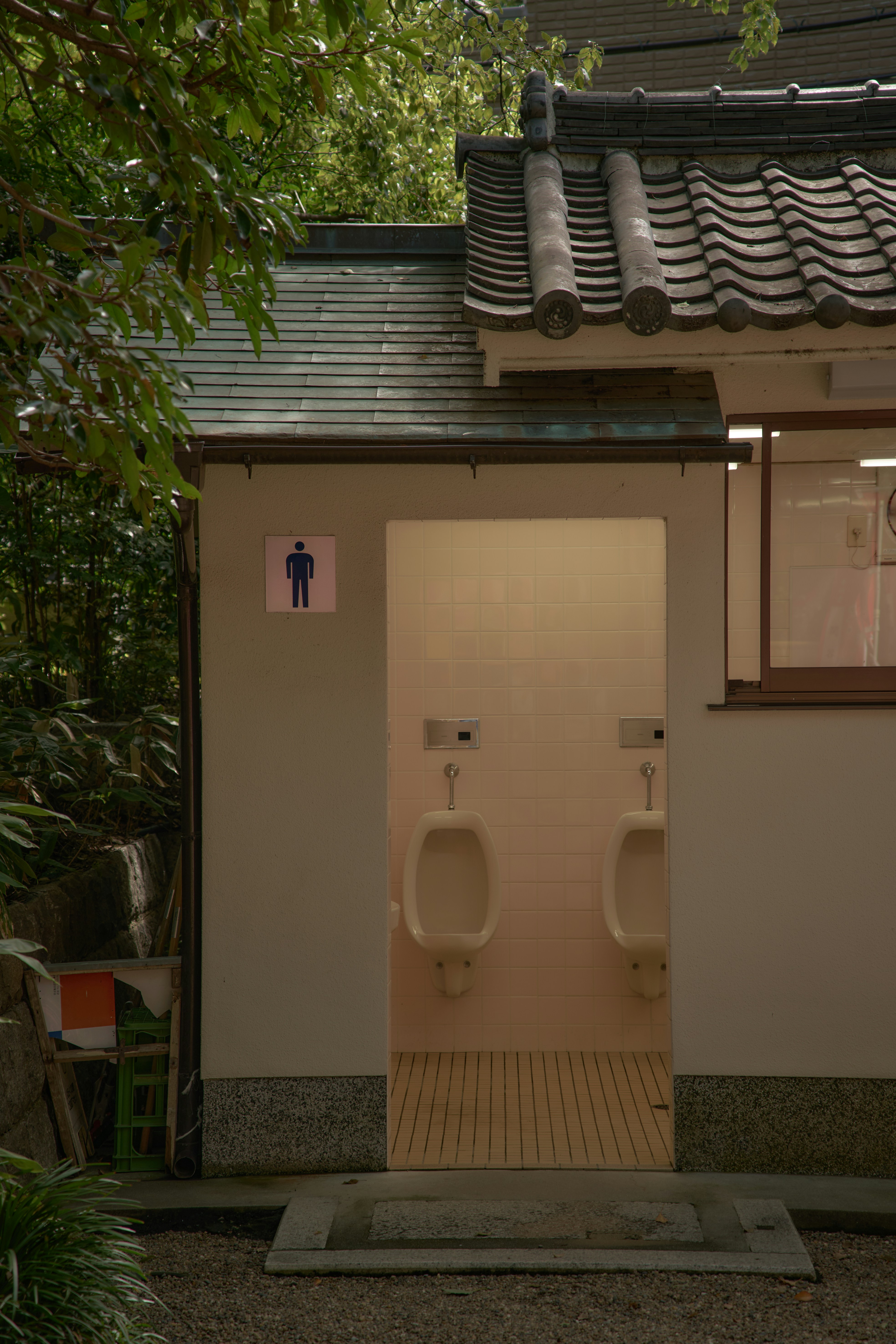 A bathroom with two urinals in it