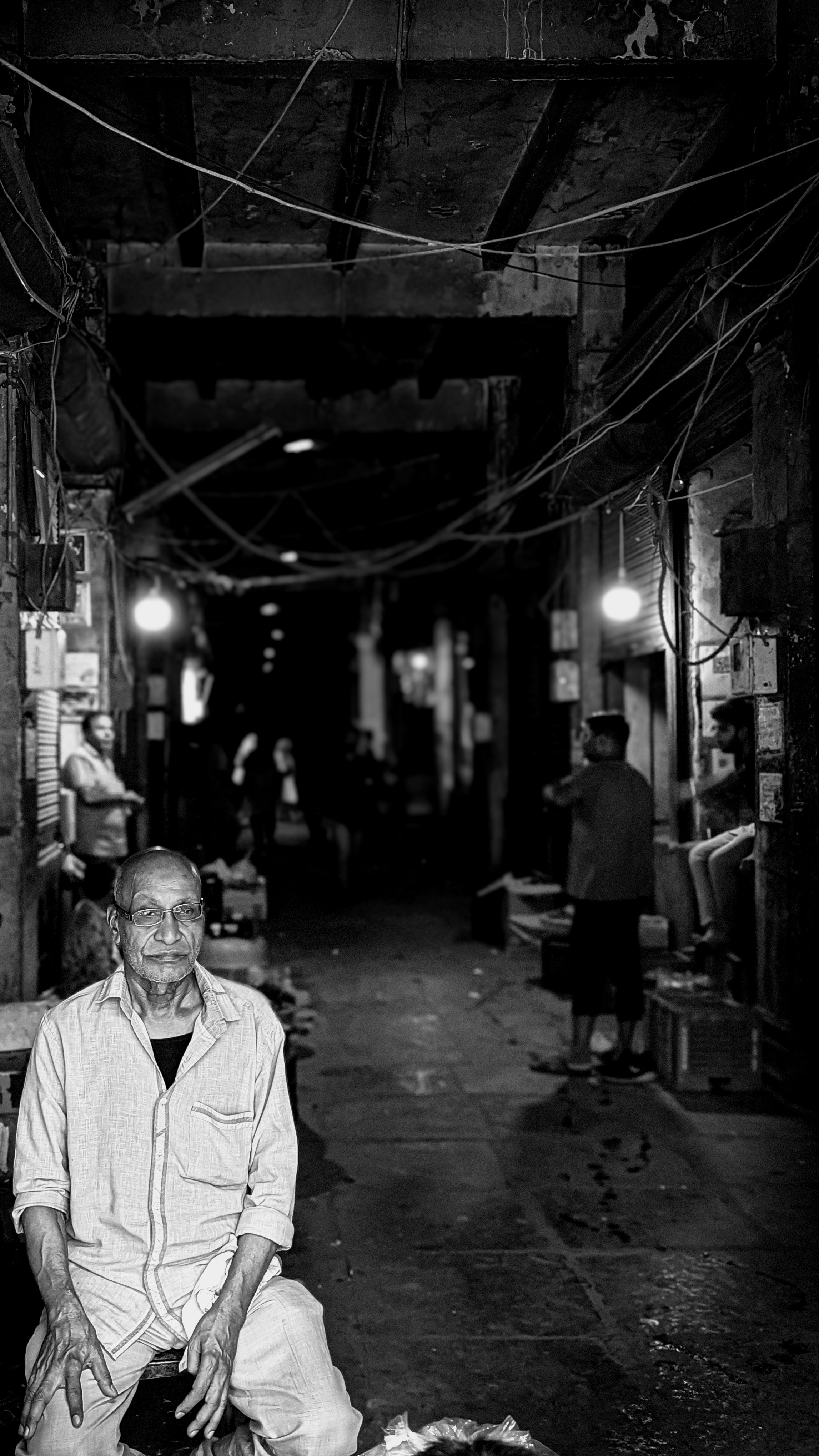 A black and white photo of a man and a dog