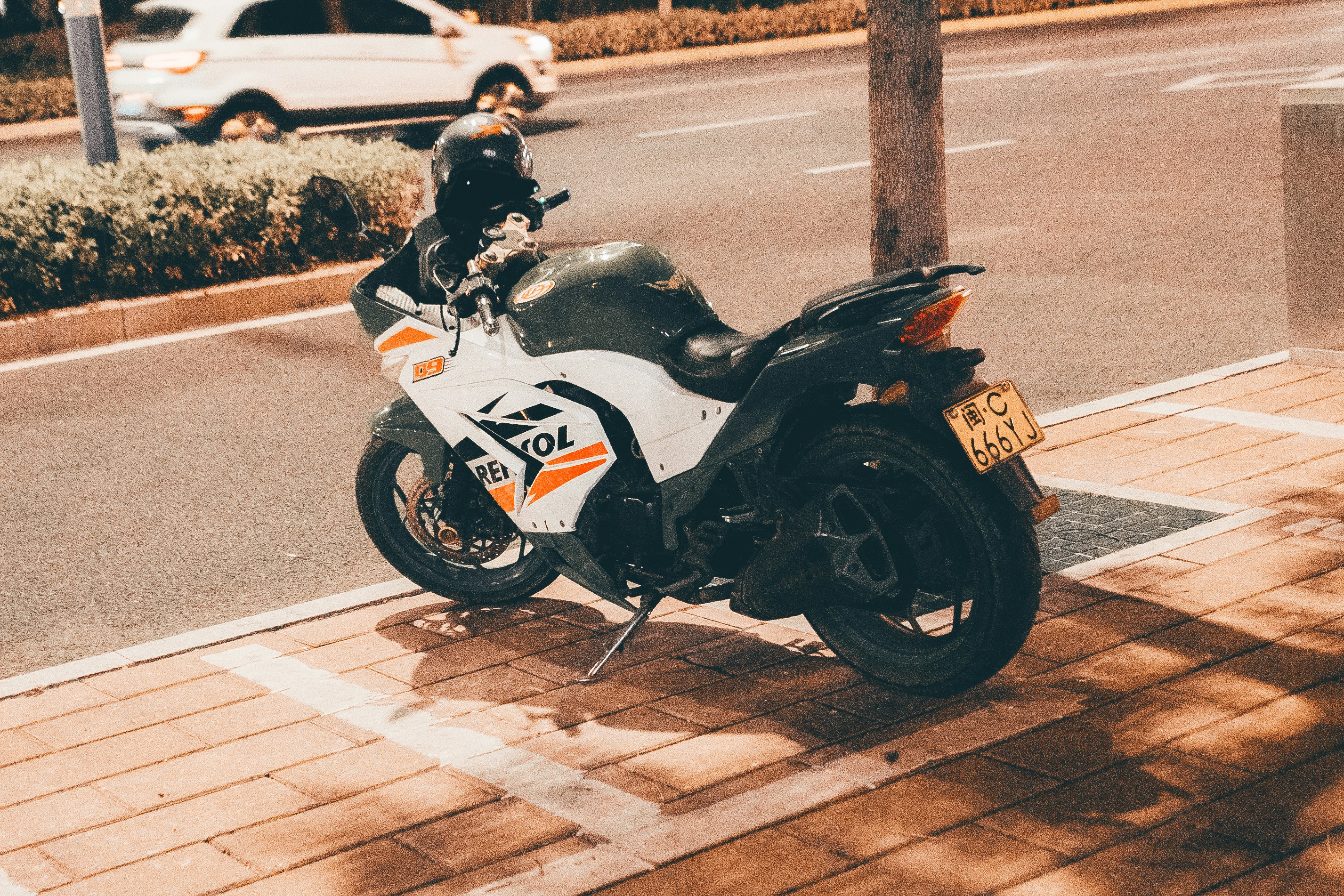 A motorcycle parked on the side of the road