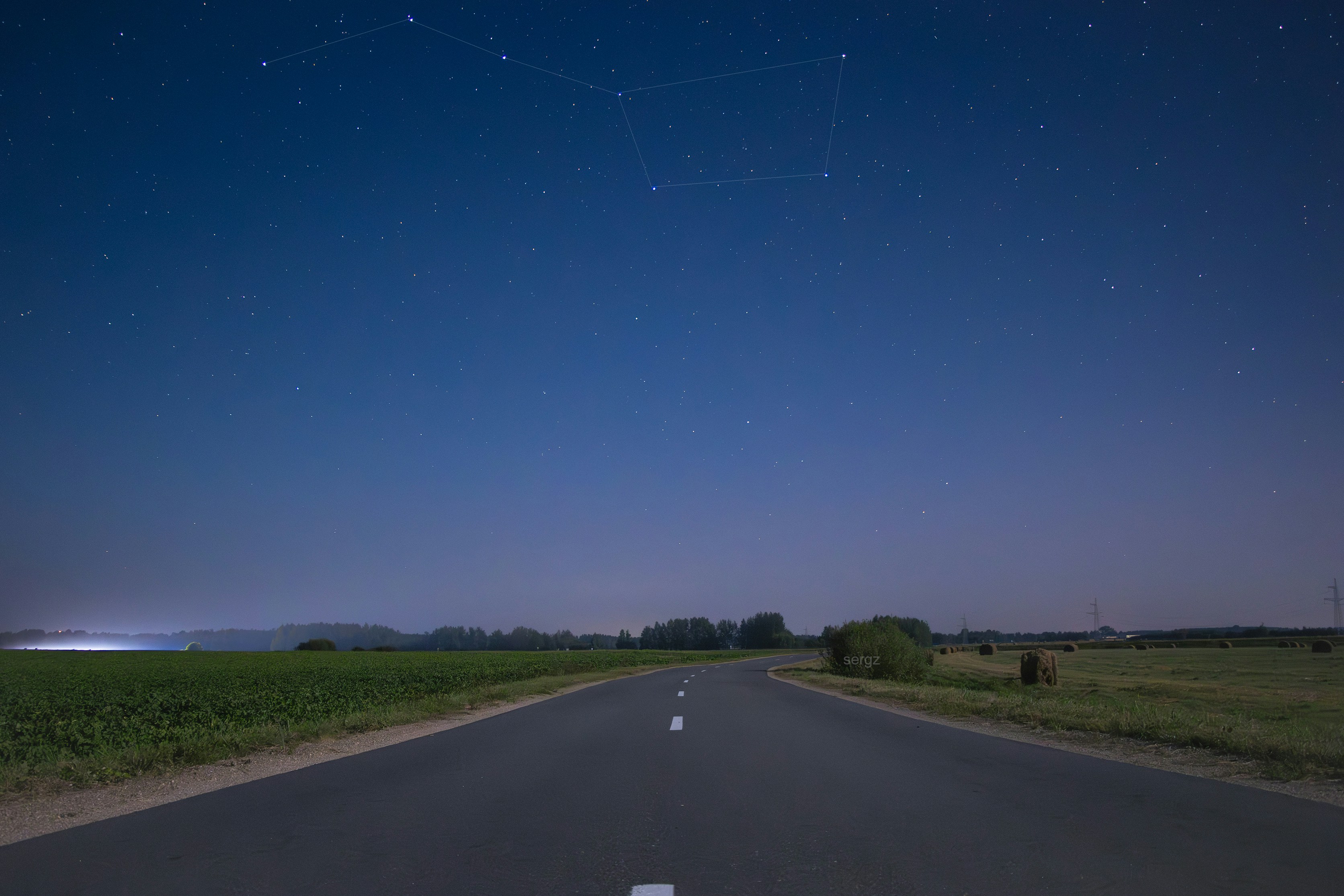 A long road with a sky full of stars