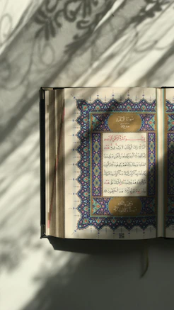 An open book with arabic writing on it