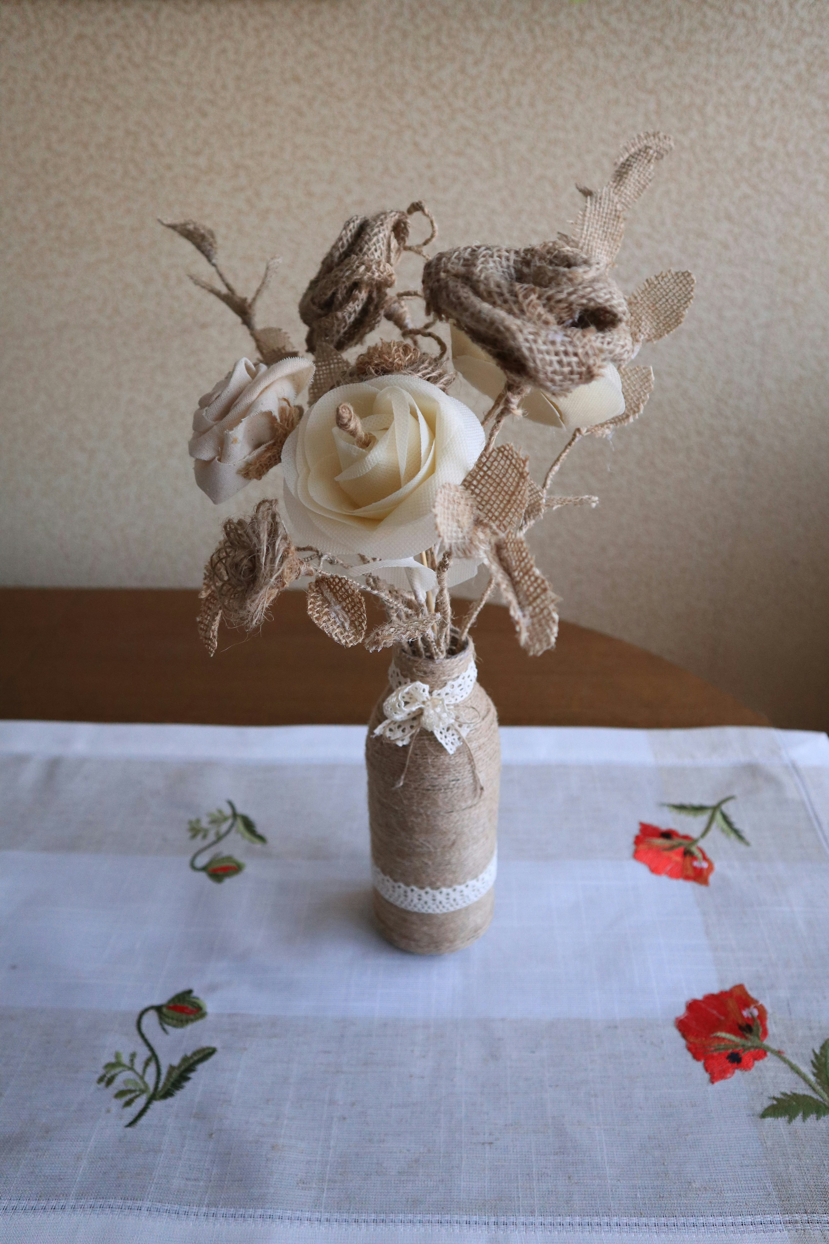 A vase filled with flowers sitting on top of a table