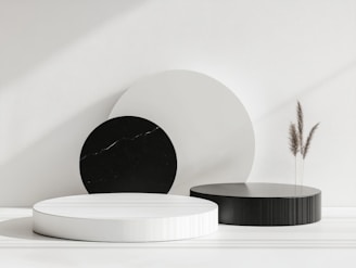 A white table topped with black and white plates