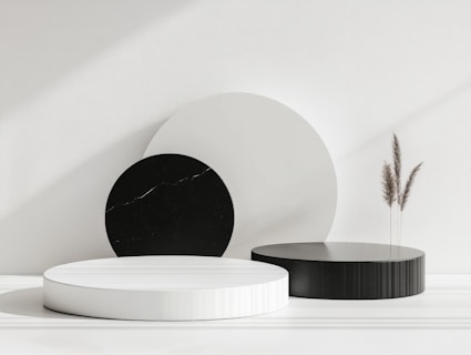 A white table topped with black and white plates
