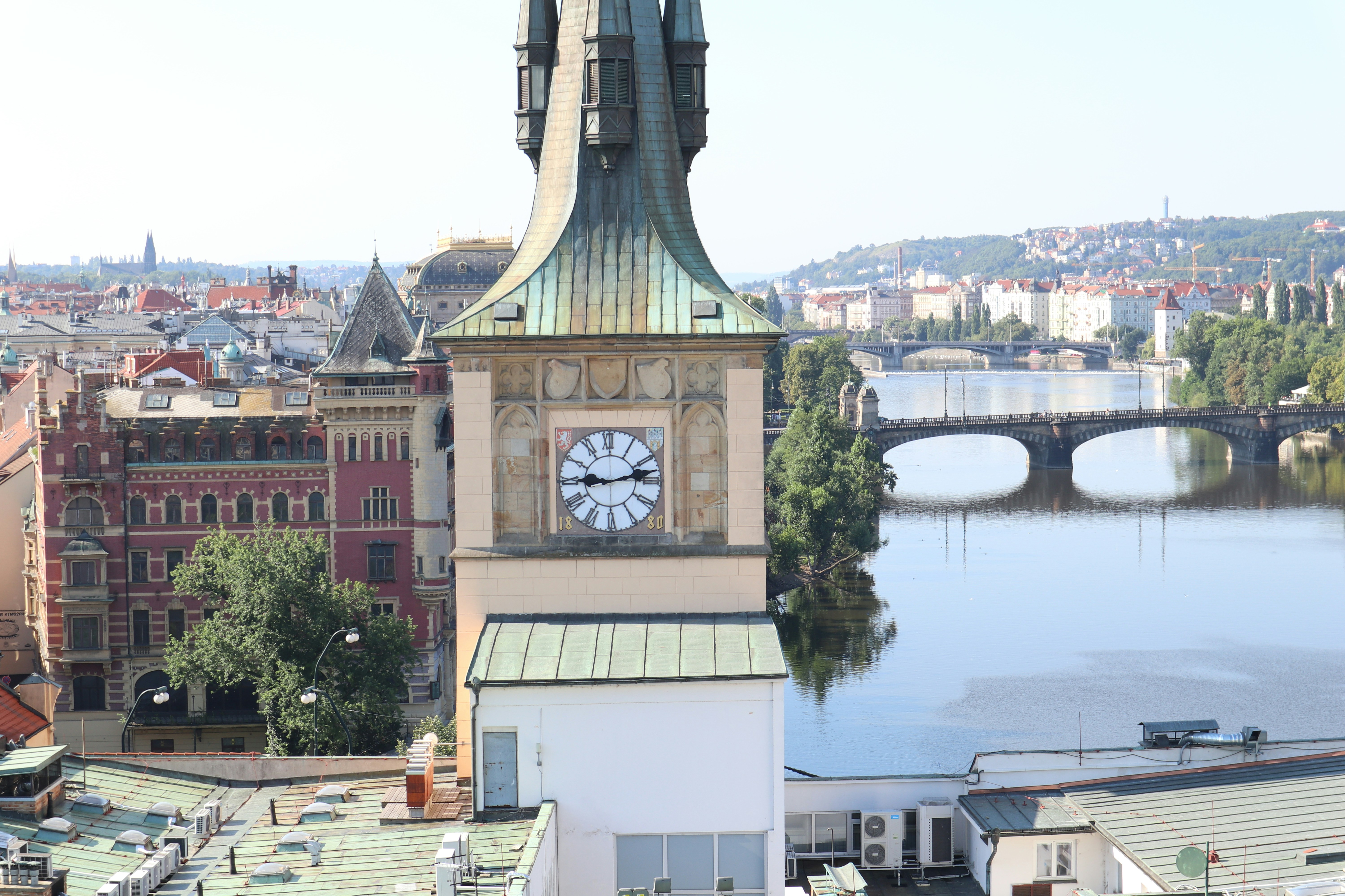 A clock tower with a bridge in the background photo – Free Wallpaper ...