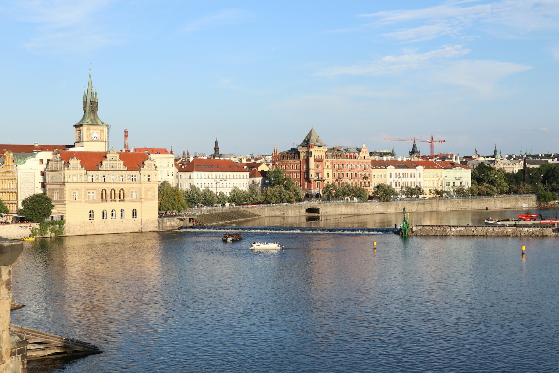 A body of water with a city in the background