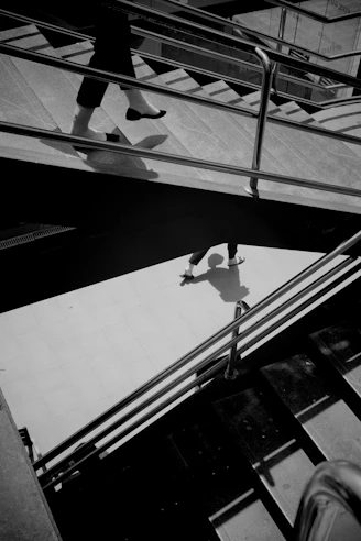 A black and white photo of a person on a skateboard