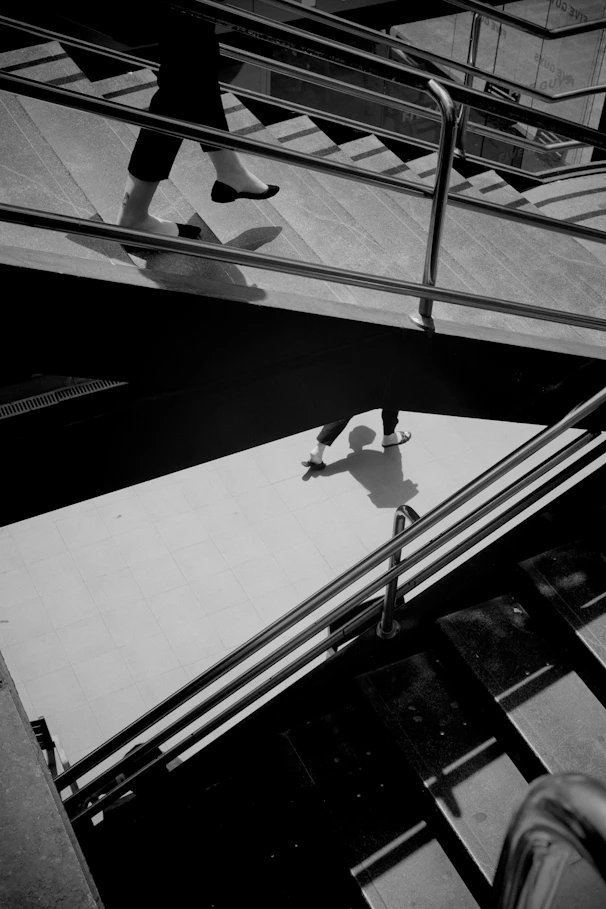 A black and white photo of a person on a skateboard