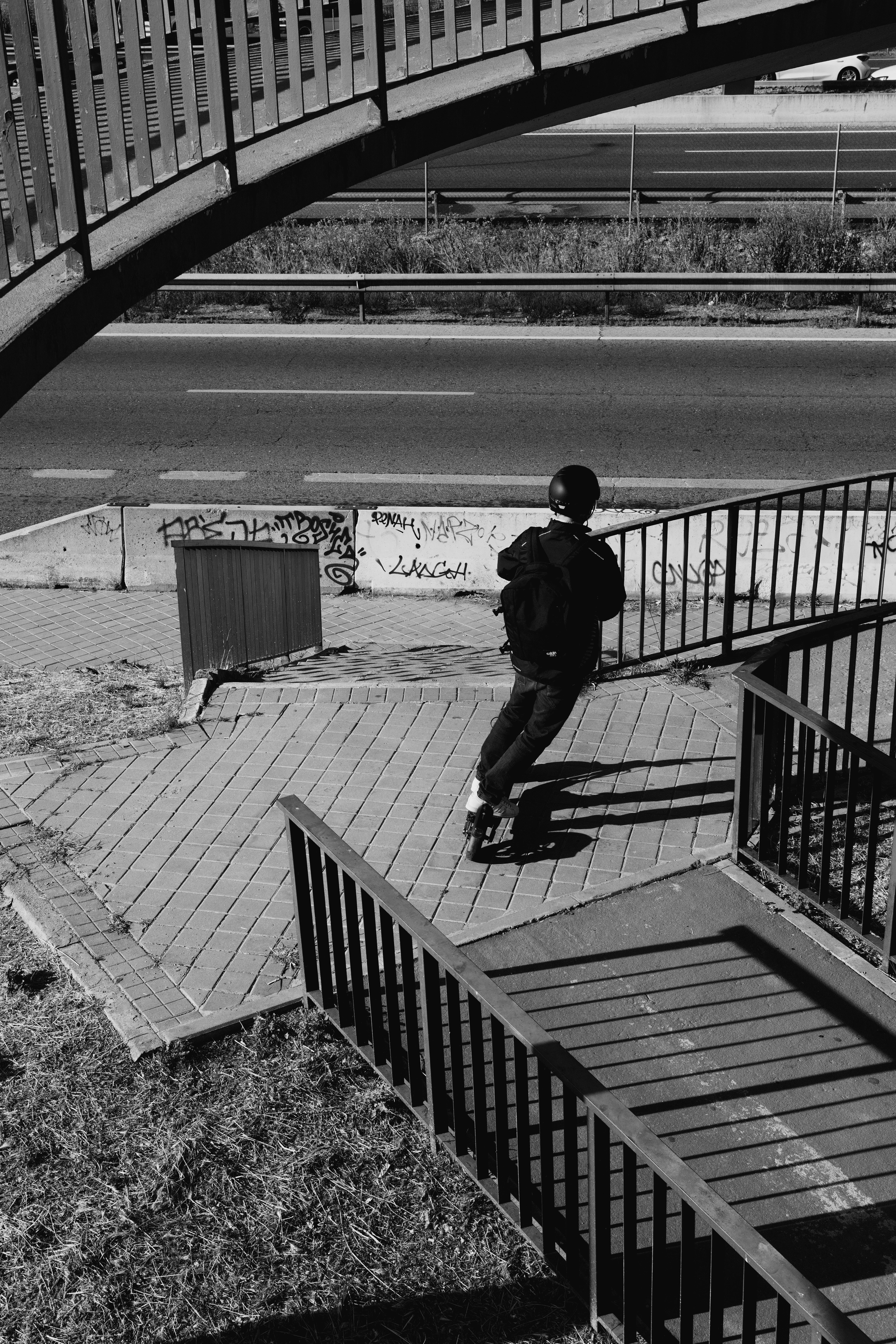 A man riding a skateboard down a flight of stairs