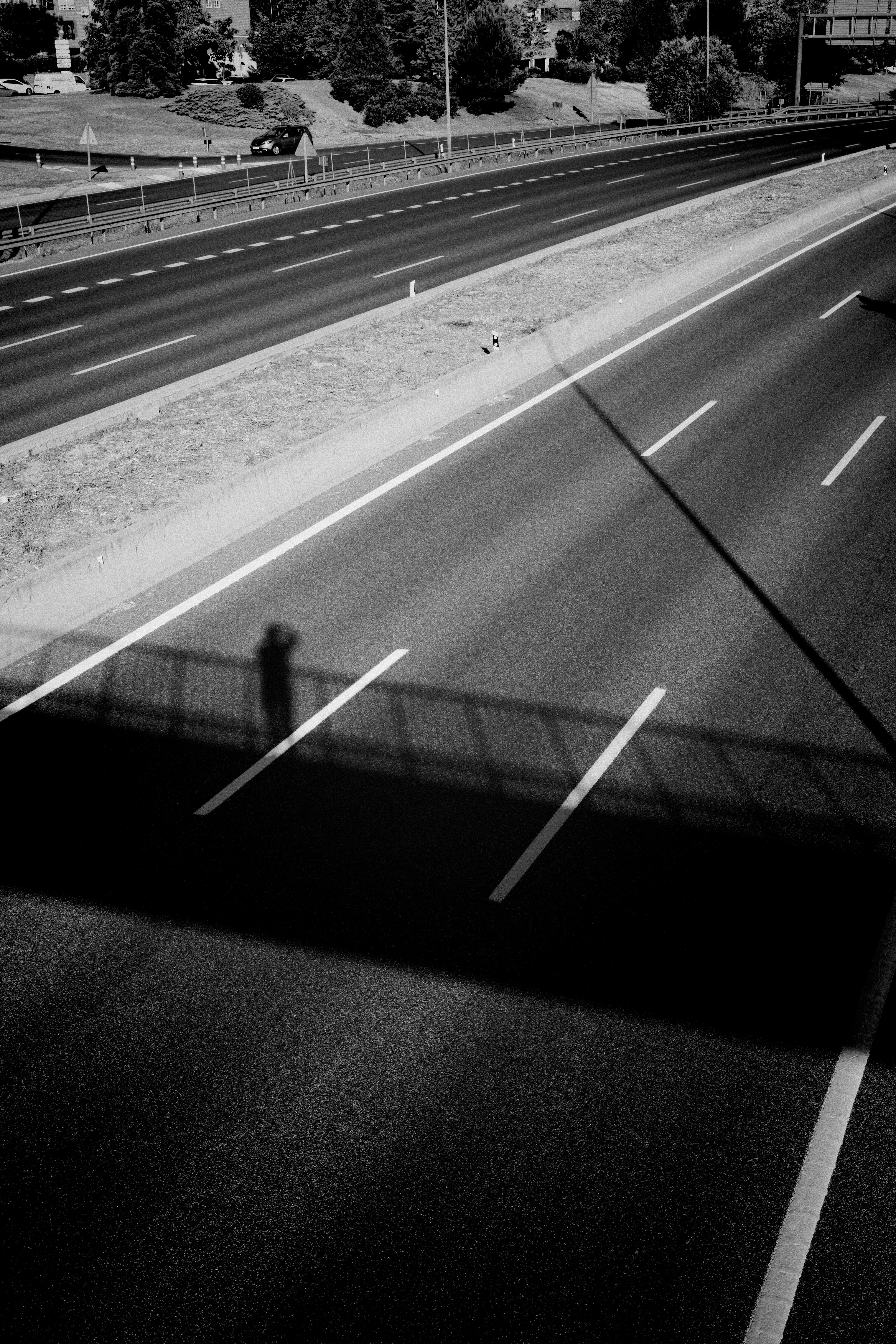 A black and white photo of a highway