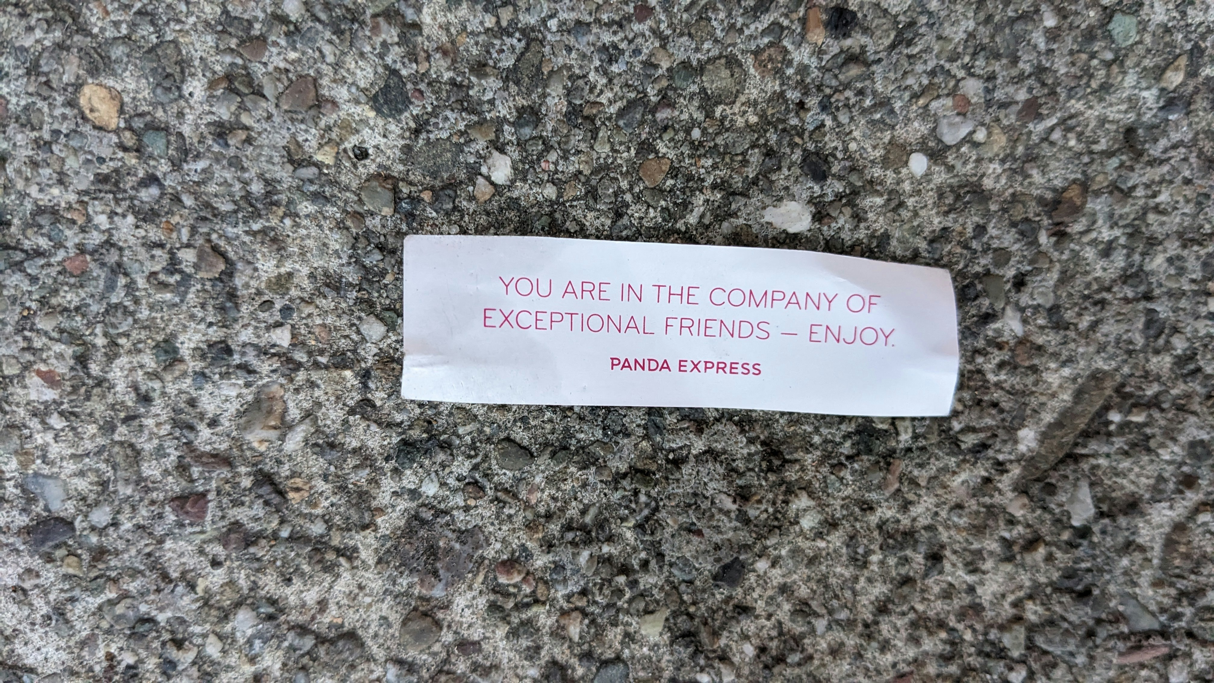 A piece of paper that is laying on the ground