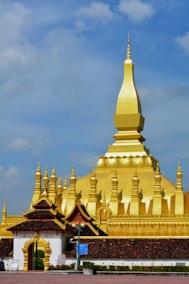 A large golden building with a sky background