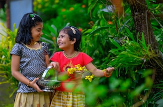 Two young girls standing next to each other